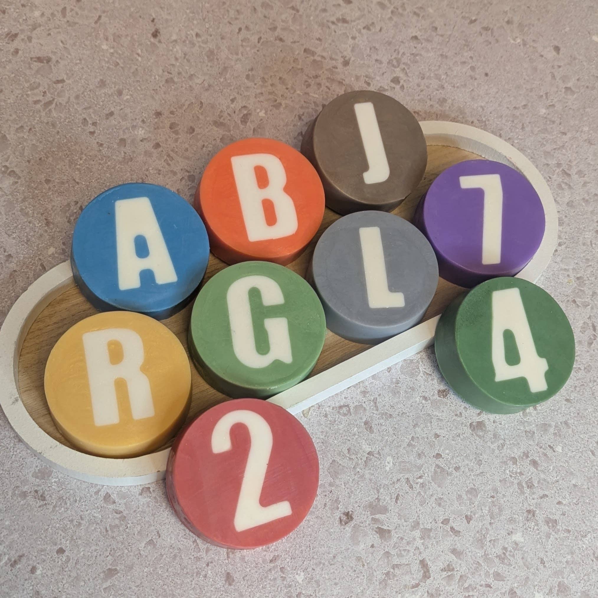 Colorful letter and number blocks on a textured surface