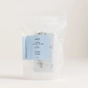 Package of 'Mist' shower steamers with a blue label on a white background