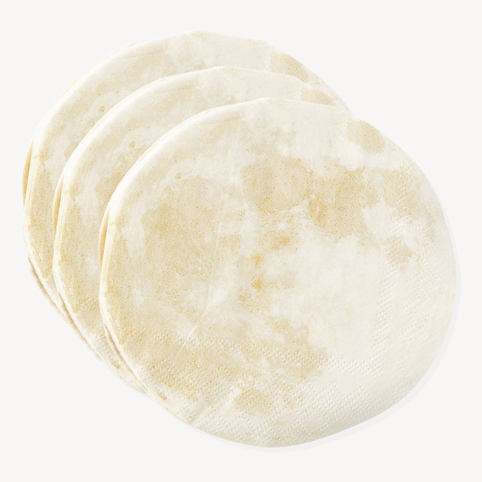 A pile of moon-shaped cut out napkin against a white background.