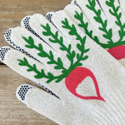 Pair of white gardening gloves with green leaf and red radish design on a wooden surface