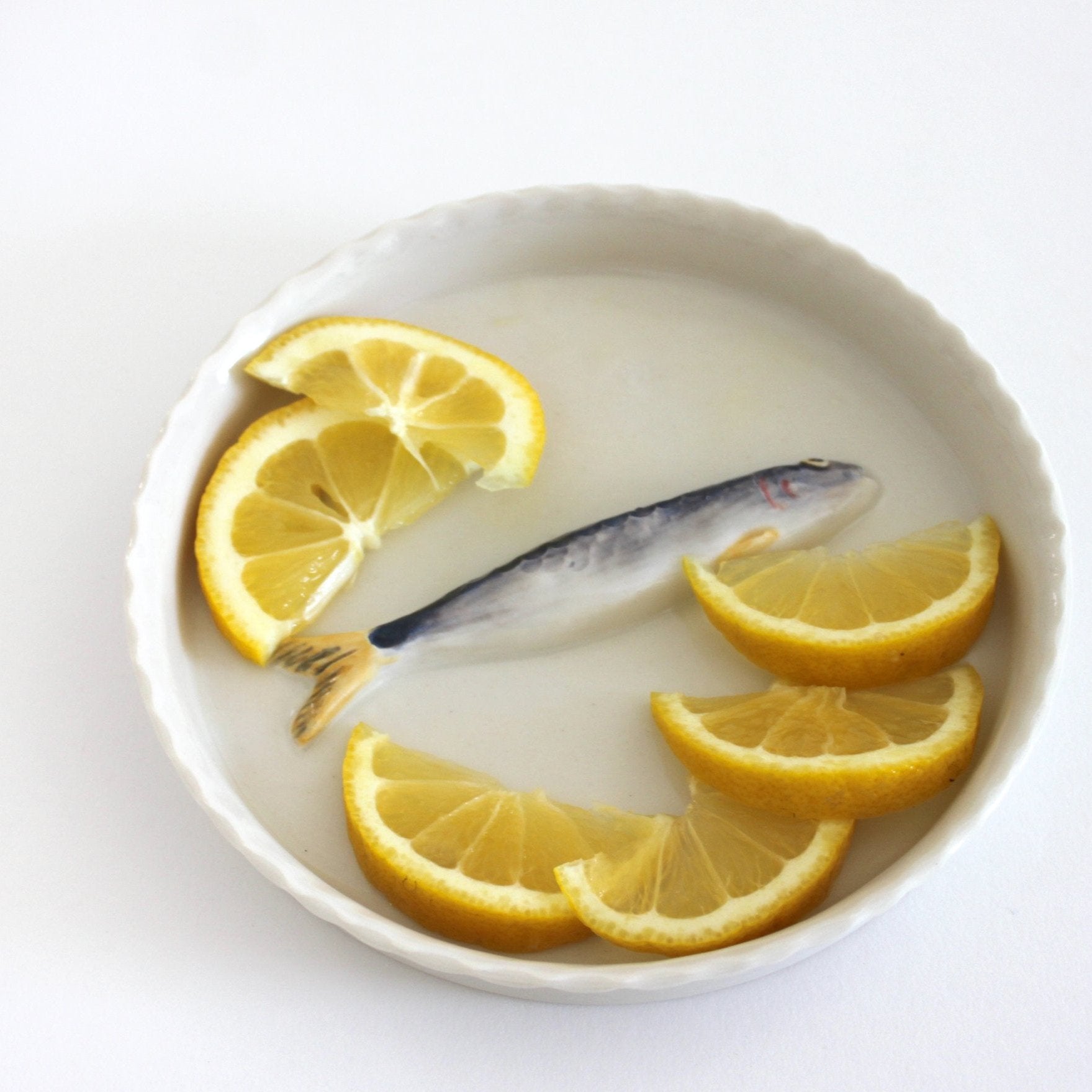 Ceramic Sardine Tray by PetitFelts featuring a colorful fish design, ideal for serving or decorative display.