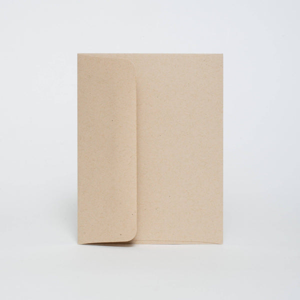 One kraft envelope resting on a white background