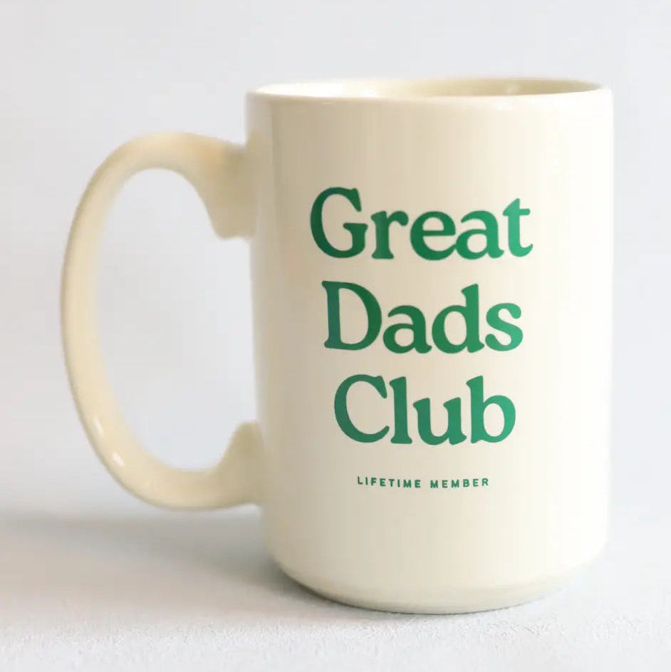 Mug with 'Great Dads Club' text on a light gray background