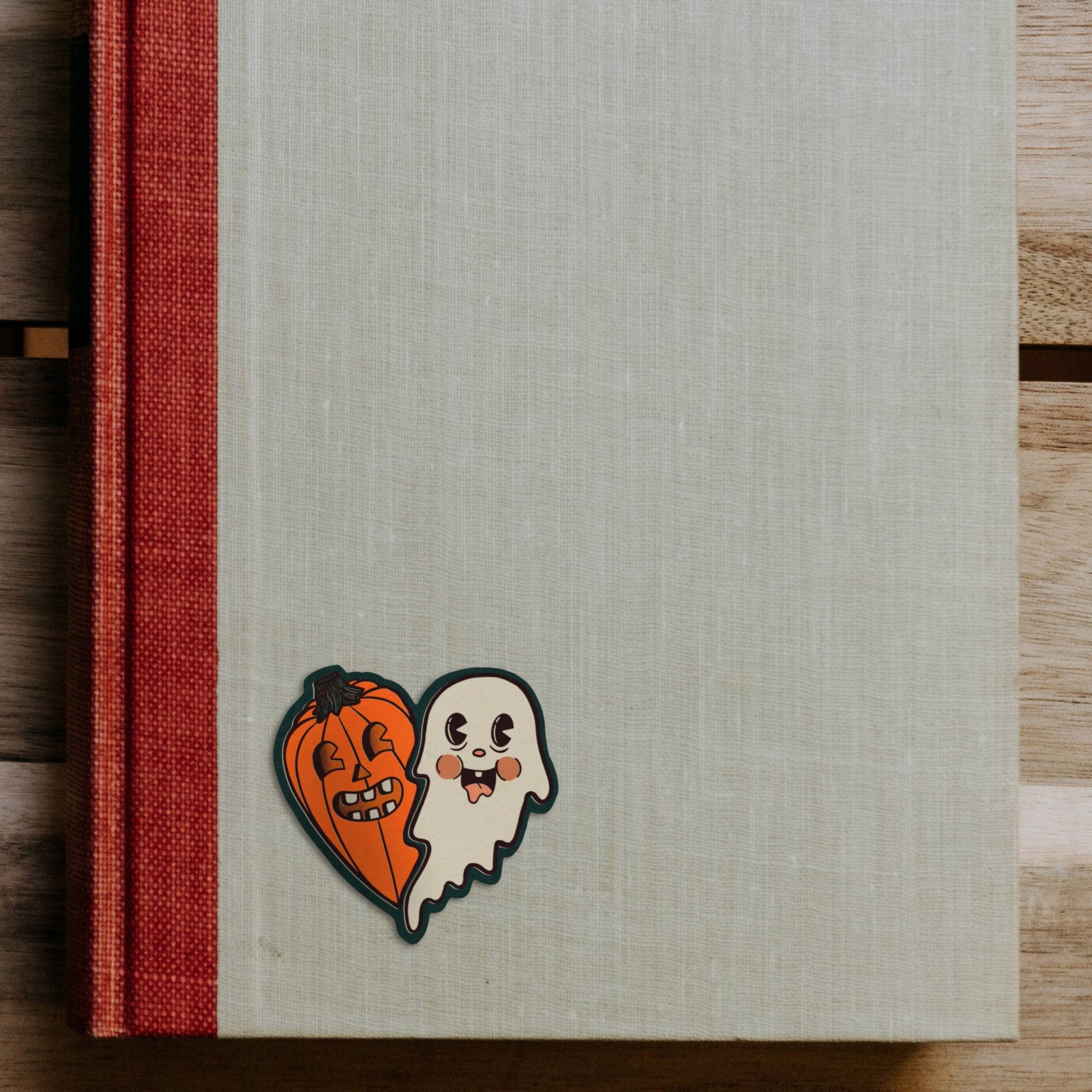Notebook with Halloween-themed design on a wooden surface