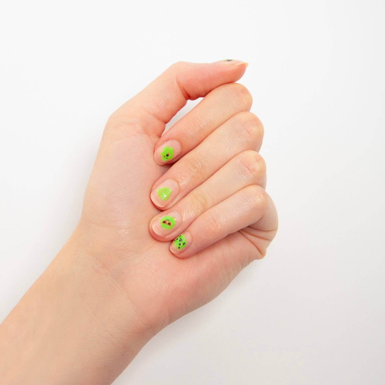 Hand with green nail polish on a white background