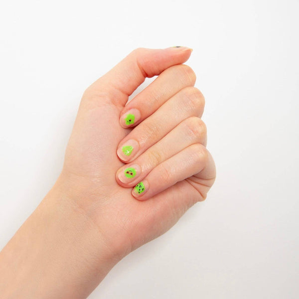 Hand with green nail polish on a white background