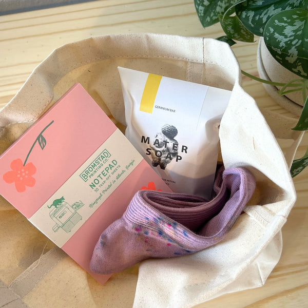 In Bloom Floral Gift Set with Mater Soap Geranium Bar, Merle Works Hand-Dyed Socks, Bromstad Printing Risograph Notepad and Canvas Bucket Tote
