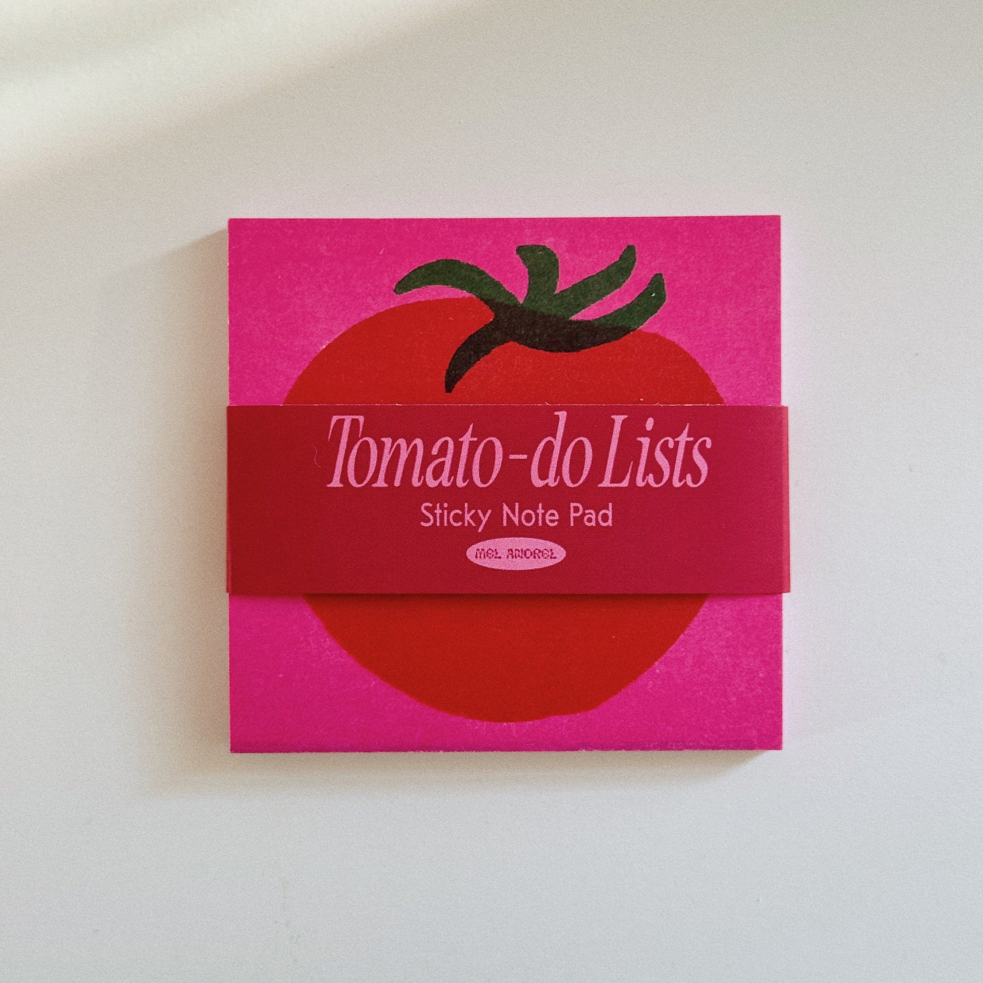 A tomato themed post it note on a blank background