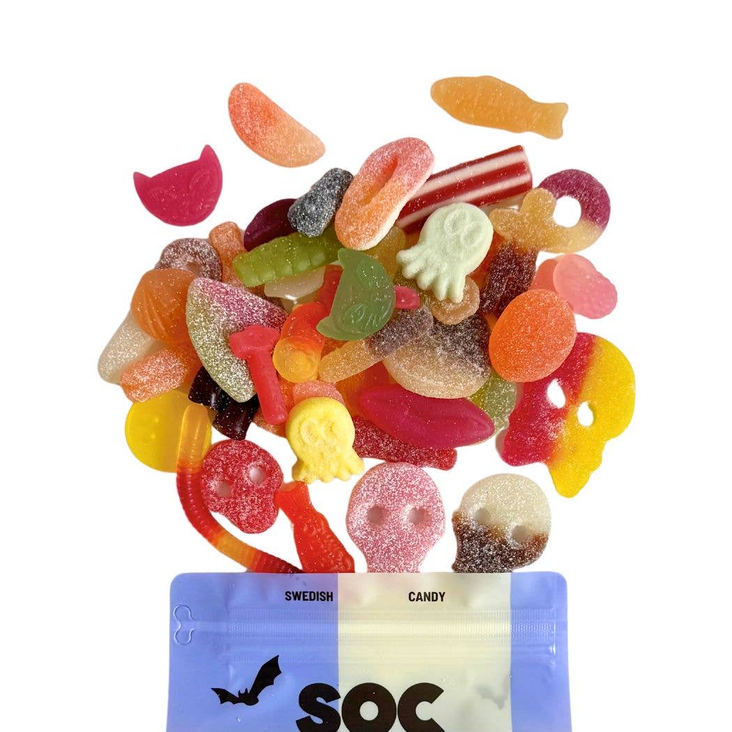 Assorted colorful Swedish gummy candies spilling out of a blue and white bag labeled 'SOC'.