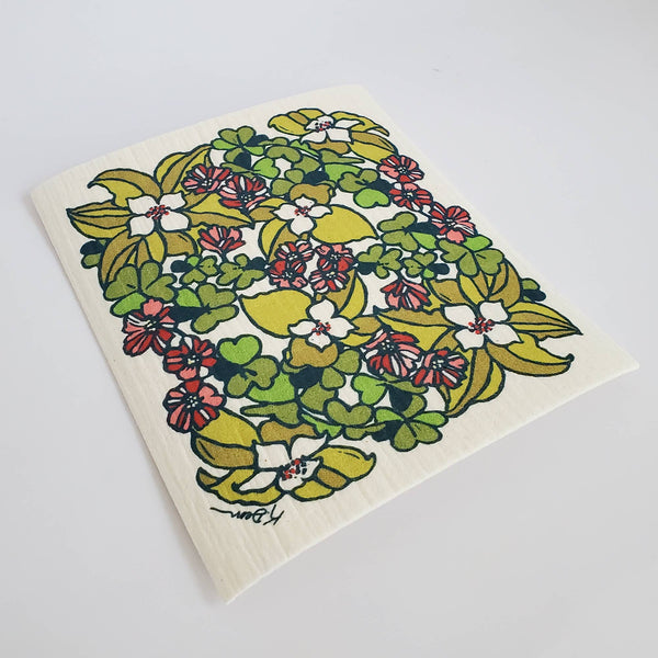 Floral patterned dishcloth on a white background