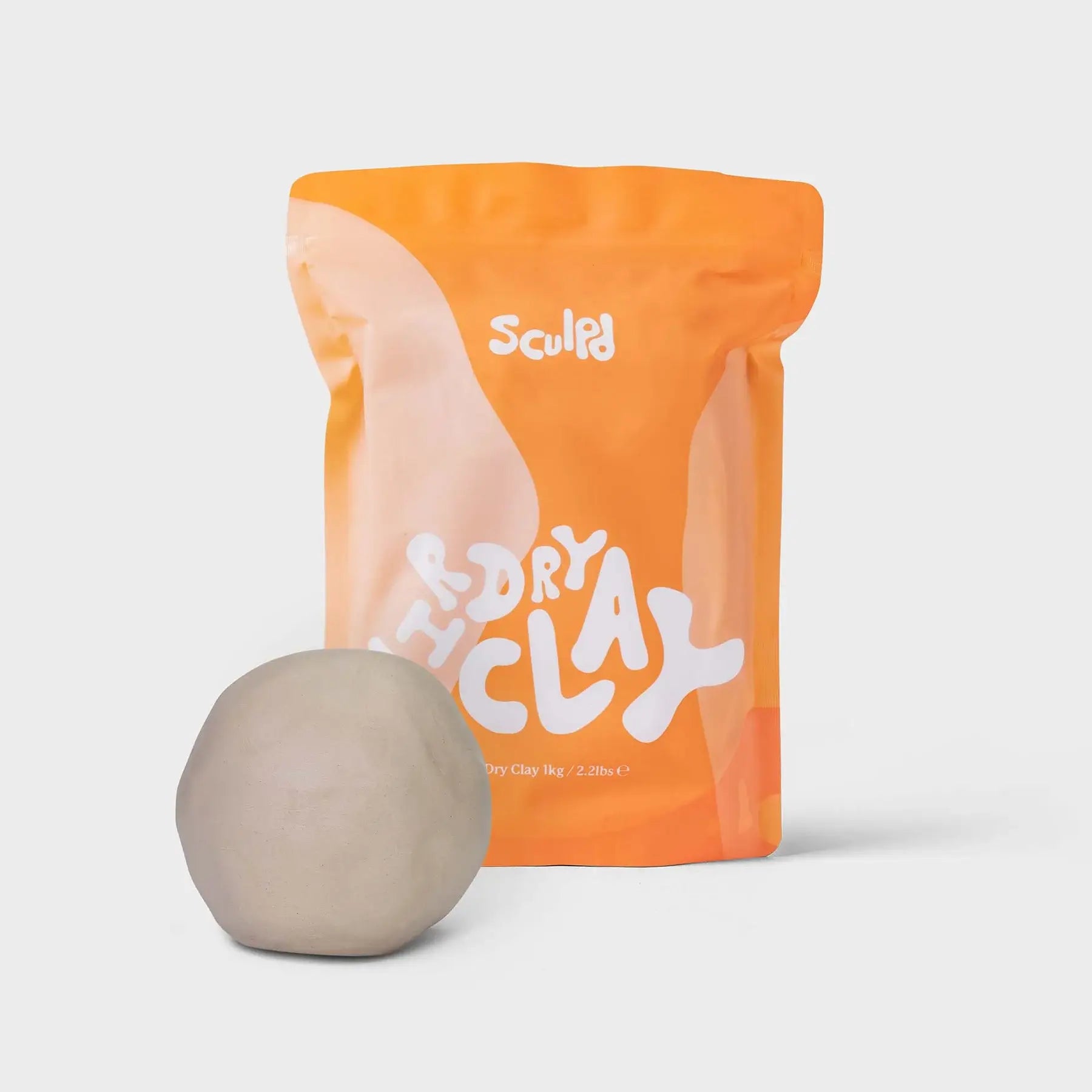 Sculpd dry clay package with a ball of clay on a light gray background