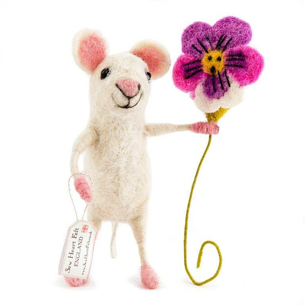 Stuffed felt mouse toy holding a flower on a white background