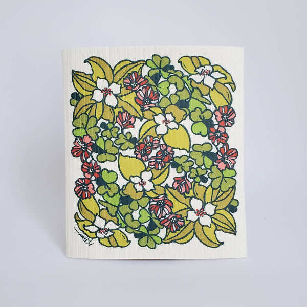 Floral patterned dishcloth on a light gray background