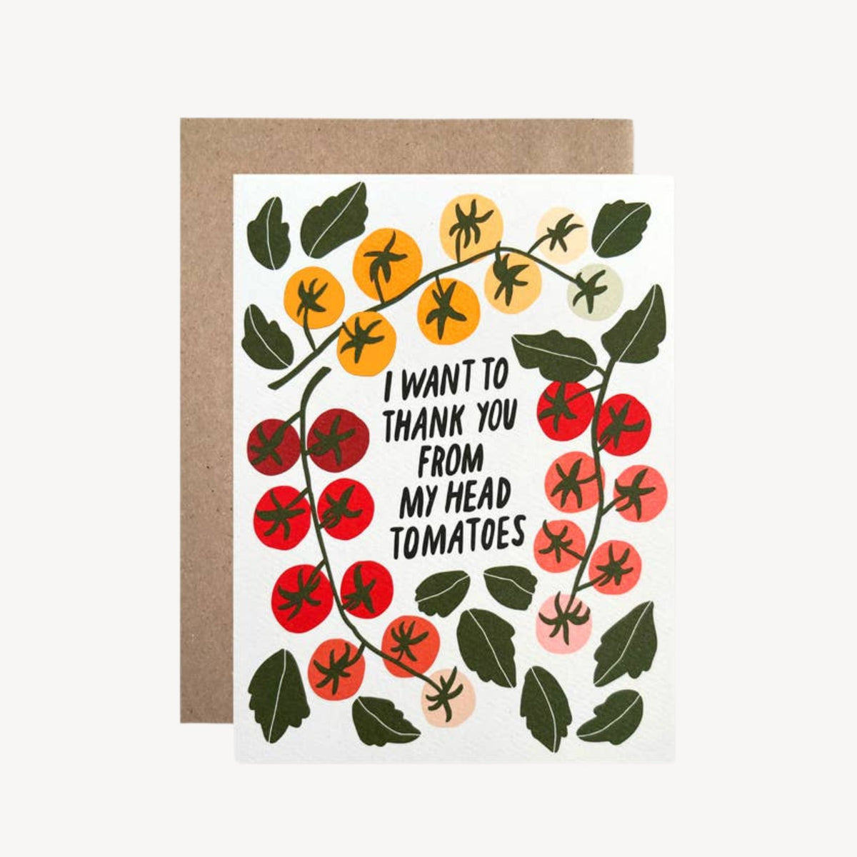 A white greeting card with a brown kraft envelope behind it, featuring an illustration of tomatoes and the text 'I WANT TO THANK YOU FROM MY HEAD TOMATOES'.