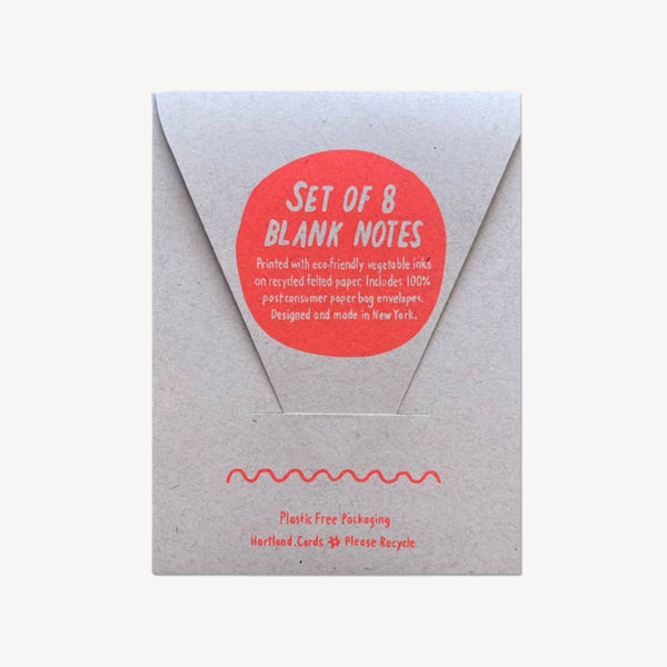 A kraft paper envelope-style package with a red circular sticker reading 'SET OF 8 BLANK NOTES' on a white background.