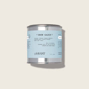 Candle can labeled 'Snow Gazer' by The New Savant on a light gray background