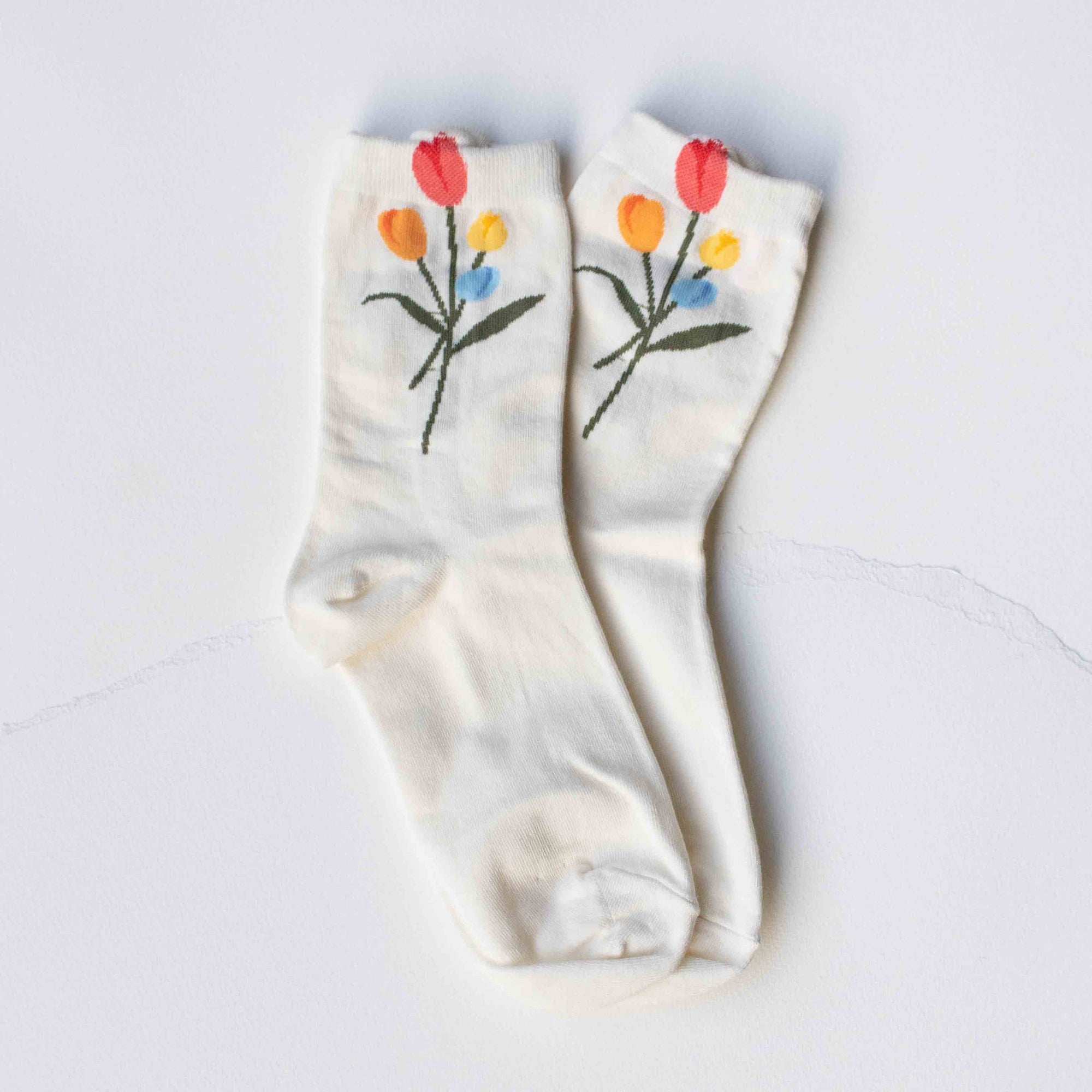 Pair of socks with floral design on a white background