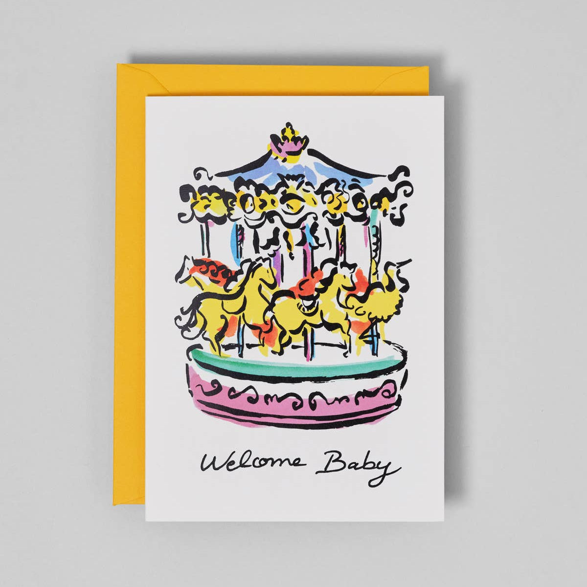 Greeting card with a colorful carousel illustration and 'Welcome Baby' text on a gray background